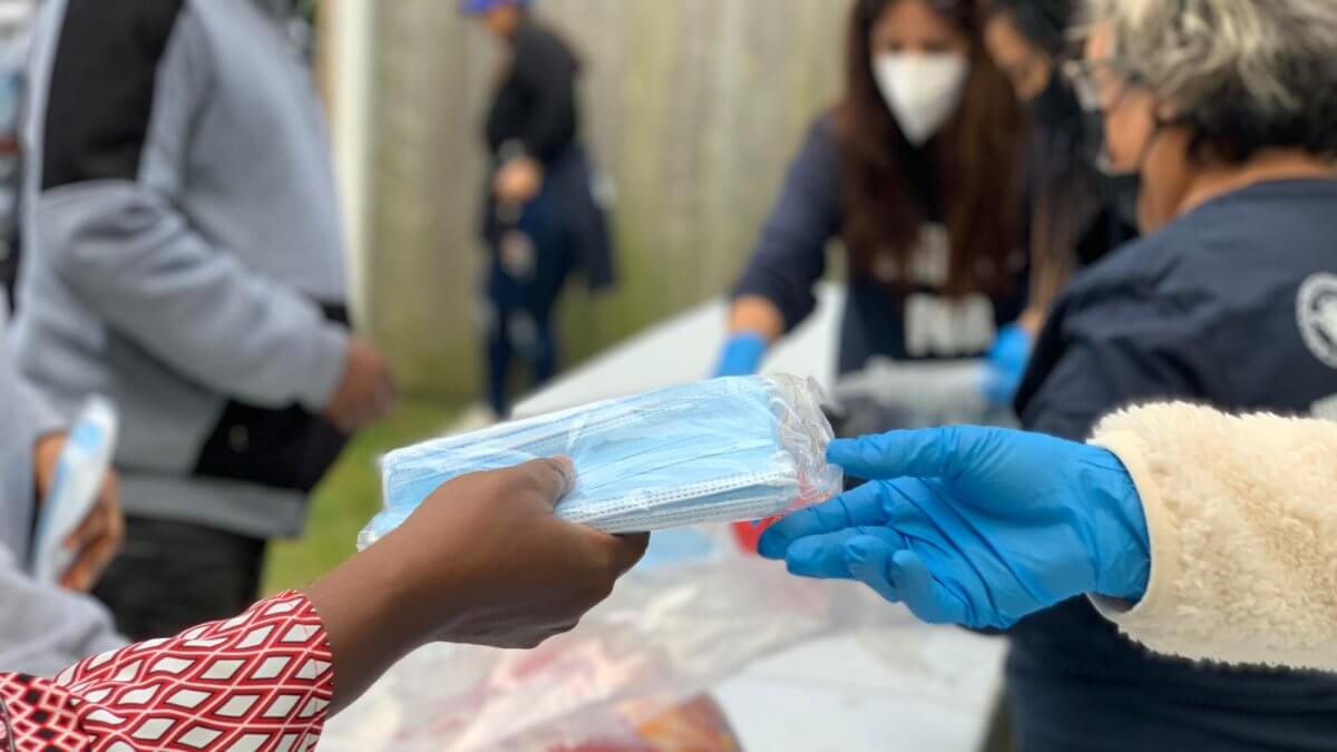 RxBIO Providing masks during a Thanksgiving event